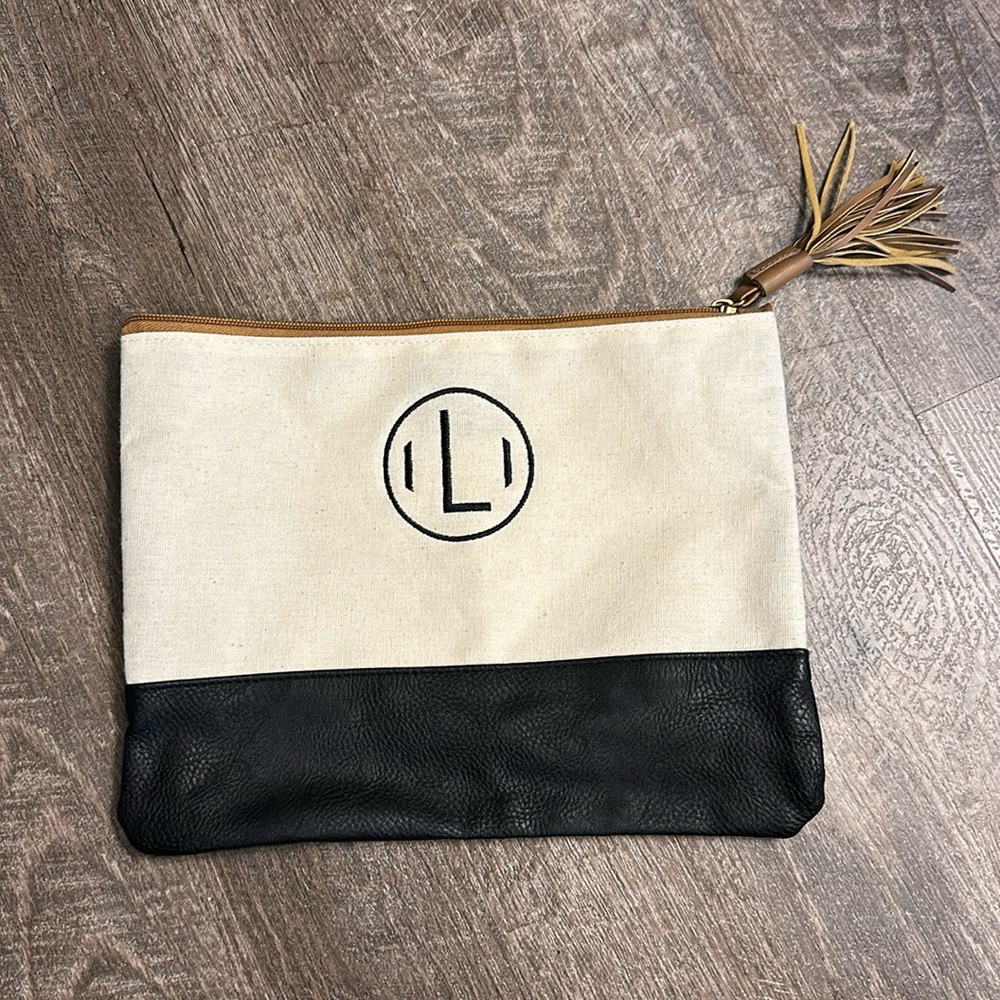 Monogram “L” clutch with dual linen top and faux leather bottom